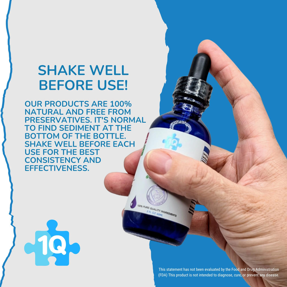 Close-up of dropper releasing a liquid drop