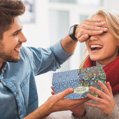 Gift-ready packaging featuring two candle tins