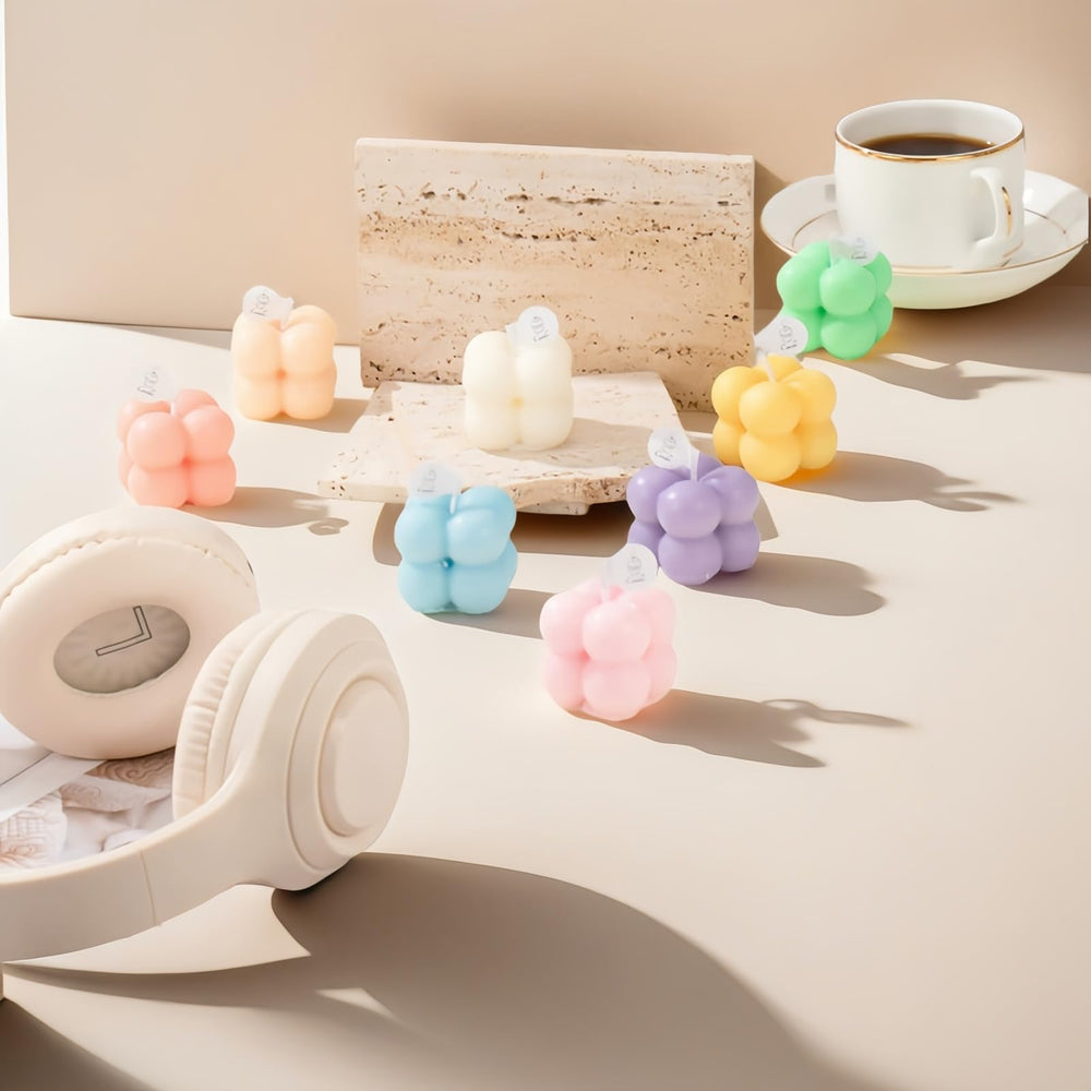 Pastel soft yellow bubble-shaped mini soy candle in frosted jar