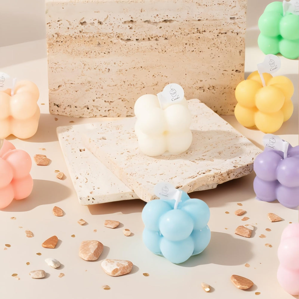 Six pastel bubble-shaped mini soy candles arranged together