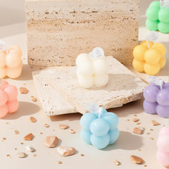 Six pastel bubble-shaped mini soy candles arranged together