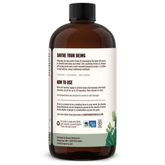 Hands applying Abhyanga self-massage with Banyan Pitta Oil