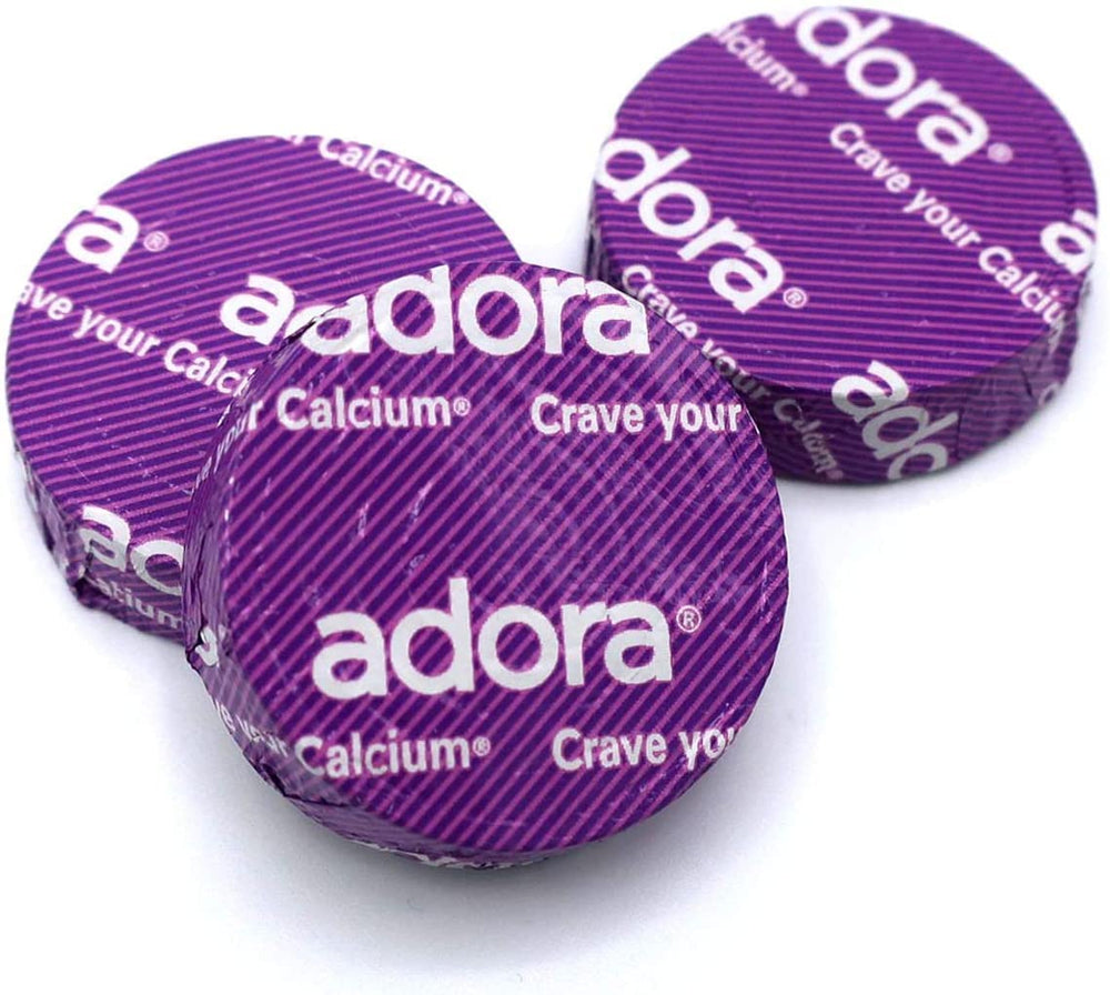 Adora Calcium supplement packaging highlighting gluten-free, NON-GMO, no trans fat