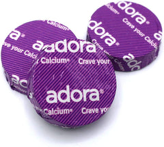 Adora Calcium supplement packaging highlighting gluten-free, NON-GMO, no trans fat
