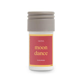 Aera Mini Moondance essential oil bottle on a warm background