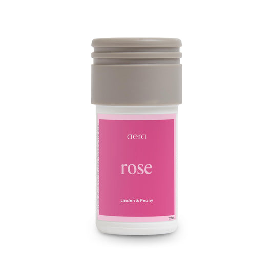 Aera Mini Rose scent refill bottle on a white background