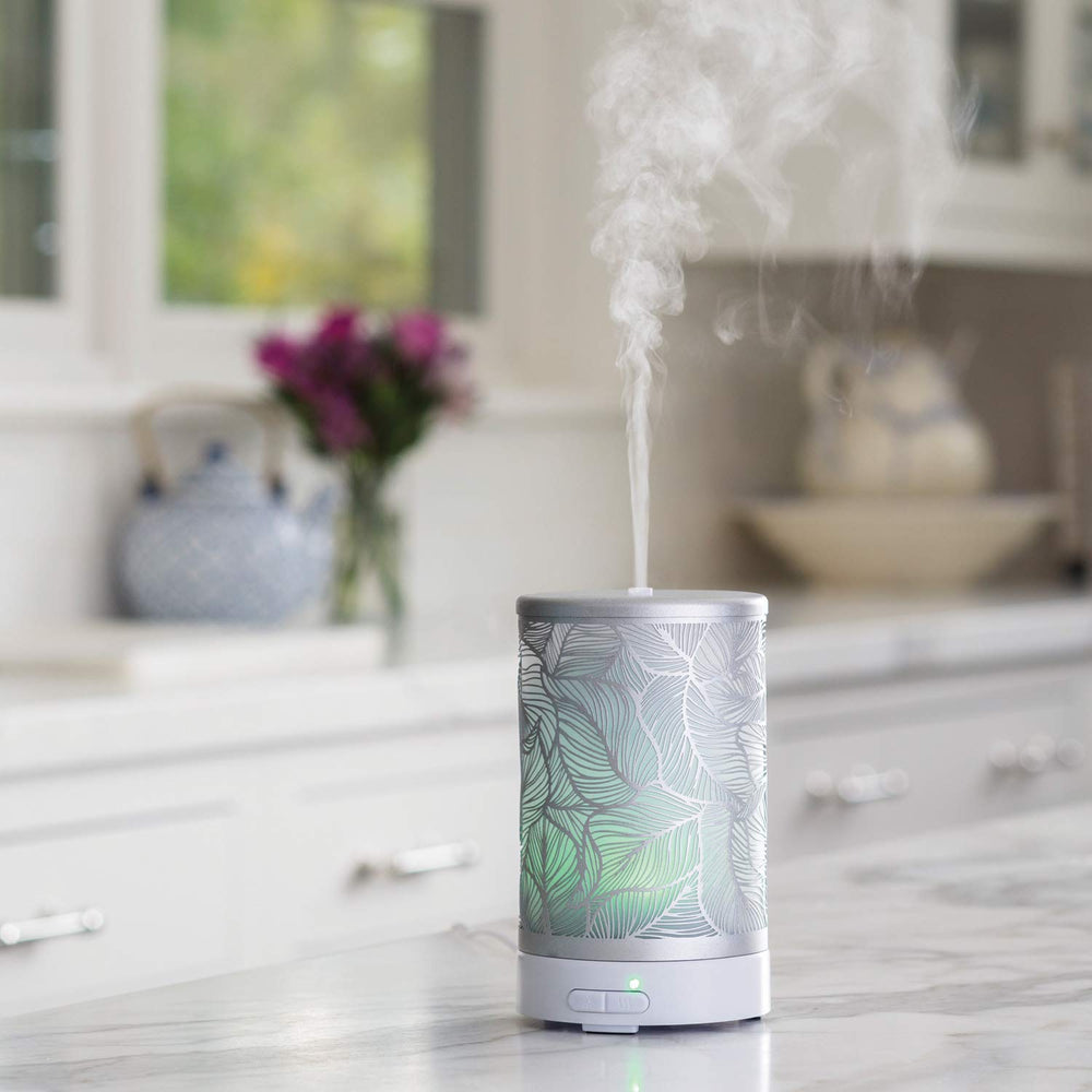 Airome Silverleaf diffuser emitting ultrasonic mist for fragrance diffusion