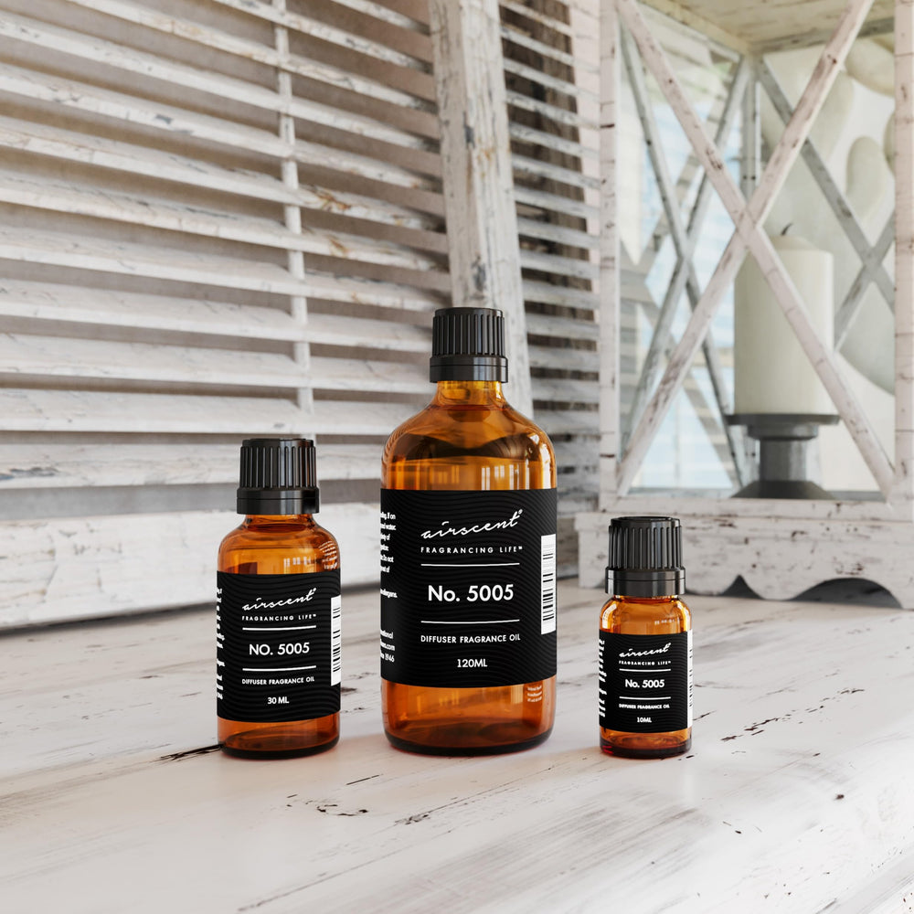 Open bottle of AirScent Oud Wood Diffuser Oil No. 5005 showing glass dropper