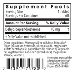 Close-up of DHEA tablets showing scored design
