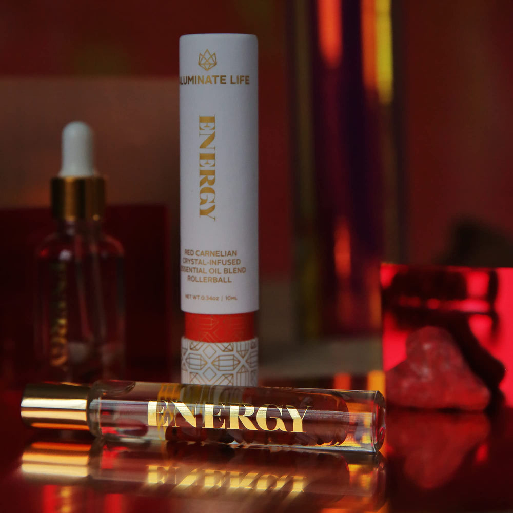Close-up of rollerball bottle showing oil and crystal infusion