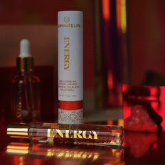Close-up of rollerball bottle showing oil and crystal infusion