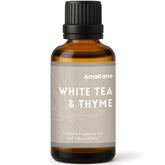 AmaKane White Tea & Thyme fragrance oil bottle on amber glass