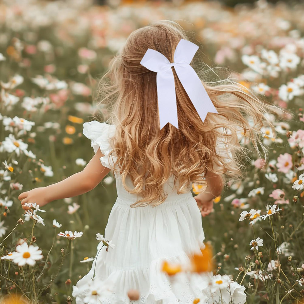 White bows enhance uniforms and boost team spirit on game day.
