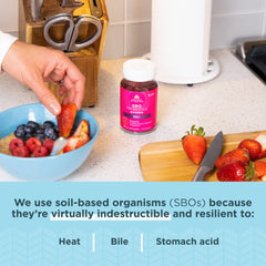 Adult and child consuming berry probiotic gummies