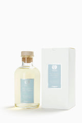 Close-up of Antica Farmacista 16.9 oz glass diffuser bottle with reeds