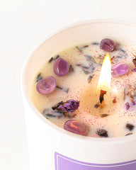 7oz soy wax candle burning with crystals inside