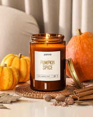 Close-up of 22 oz soy wax candle burning with autumn scent
