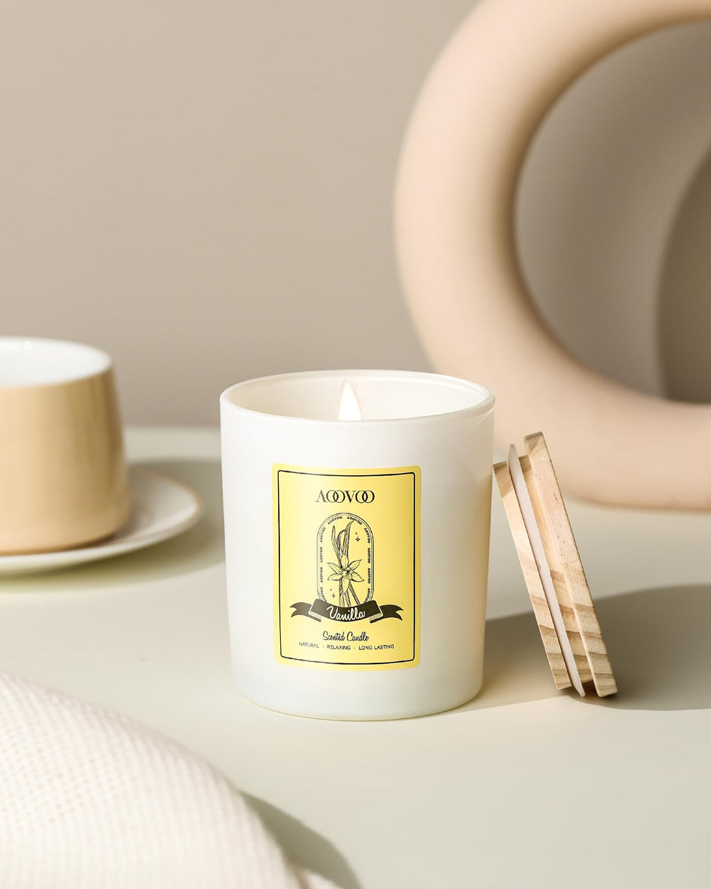 Close-up of vanilla candle with crystals and floral notes
