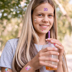Aposwow tattoo sheets pairing with cups and props for playful party decor