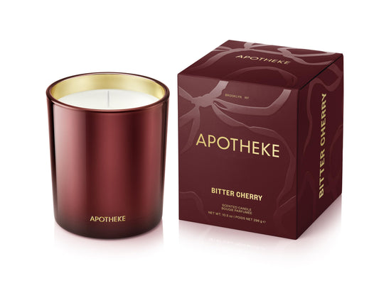 APOTHEKE Bitter Cherry candle in a large red 10.5 oz glass jar