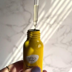 APTO Turmeric Oil with Rosemary packaging close-up emphasizes sustainable packaging.