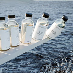 Aqua di Miami diffuser oil with wood-toned background