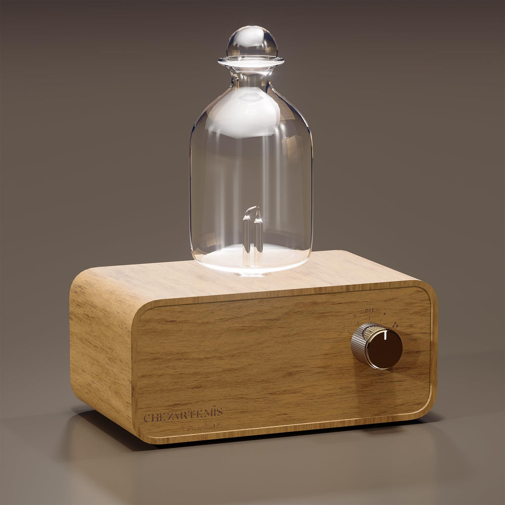 Aria diffuser with glass body and handmade wood base close-up