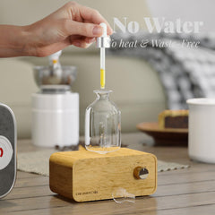 Rechargeable portable essential oil diffuser with glass body viewed from side