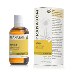 Hands applying Arnica oil for joint and muscle relief