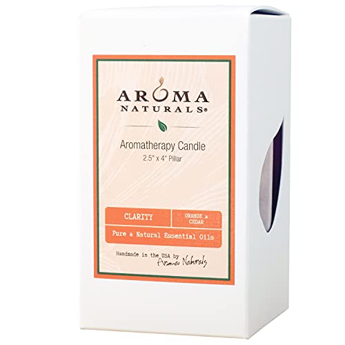 Side view of orange and cedar essential oil pillar candle