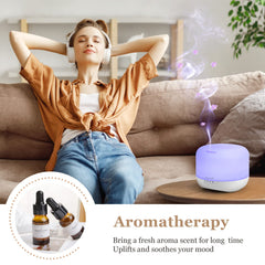 White ultrasonic diffuser with remote control in a living room