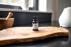Steam-distilled Juniper Berry oil in glass bottle