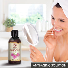 AROMATIKA Burdock Oil texture close-up shows moisturizing feel for skin.