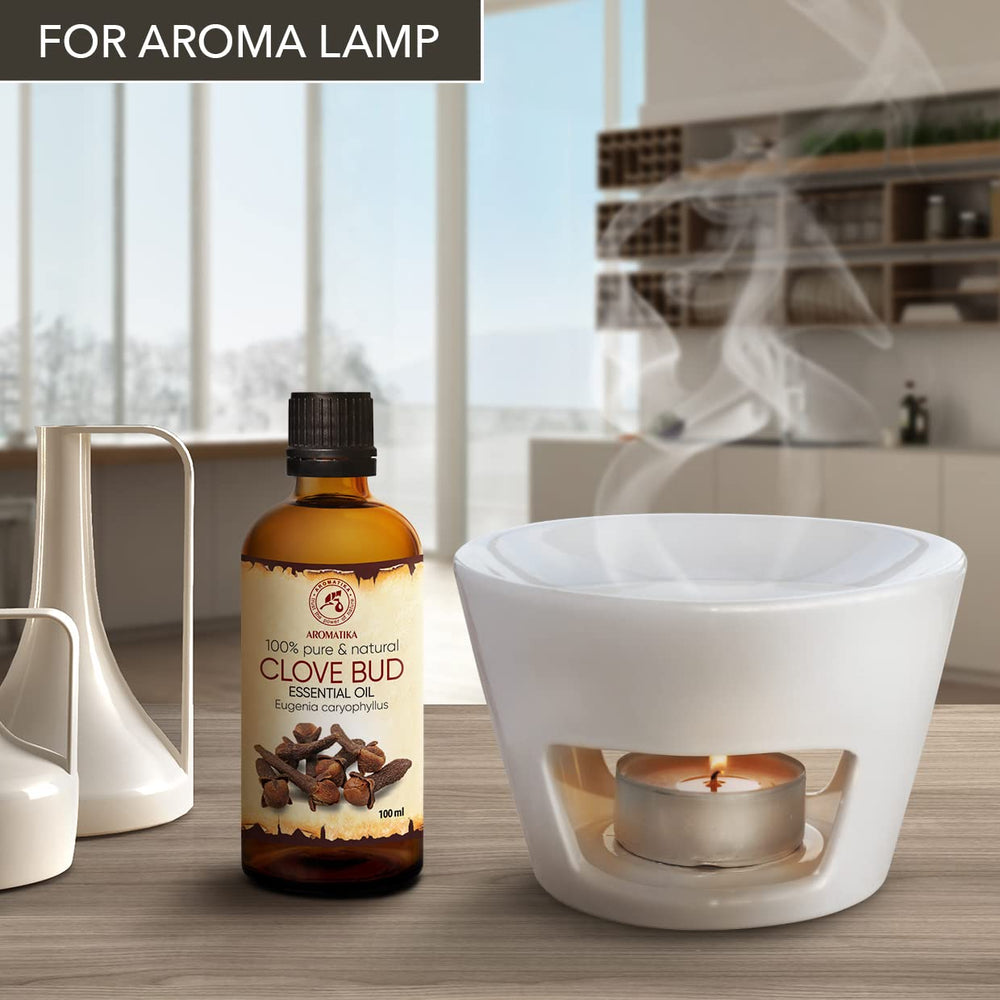 AROMATIKA Clove Bud Oil amber bottle highlights premium quality and rich aroma.