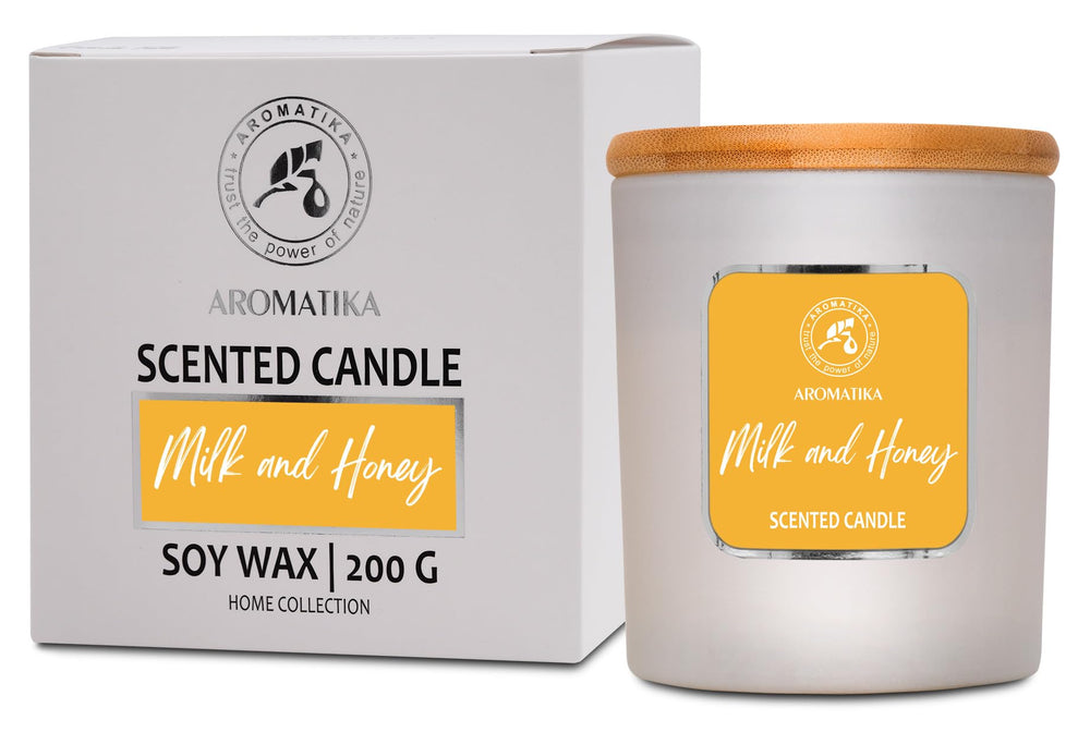 AROMATIKA Milk & Honey candle in a glass jar for warm, inviting home ambiance.