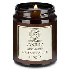 AROMATIKA Scented Massage Candle Vanilla pour captures a cozy scene, offering skin-nourishing massage and calming aroma.