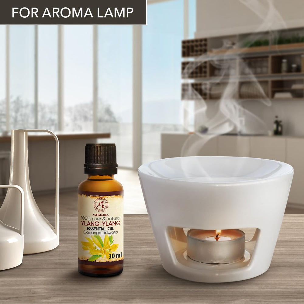 AROMATIKA Ylang Ylang oil dropper ready for facial skin nourishment.