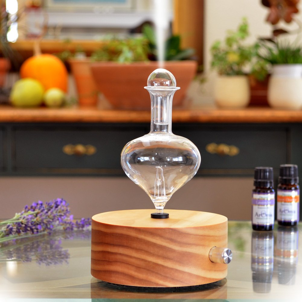 Close-up of wooden base and glass reservoir showing plastic-free design