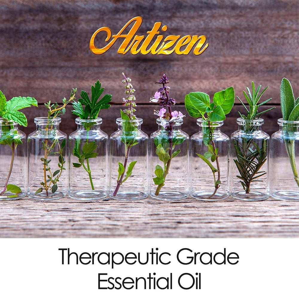 Lavender sprigs beside a 2 fl oz bottle of Artizen Lavender Essential Oil.