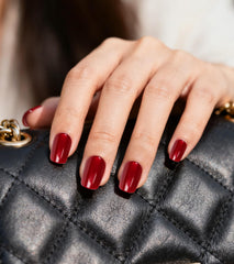 Artquee red cat eye nails on hand showing square shape for everyday wear.