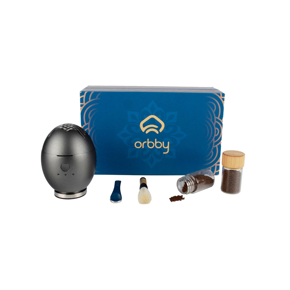 Artronic Orbby mini diffuser on a clean desk setup for portable scenting.