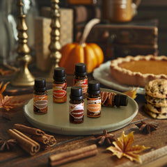 Pumpkin Pie and Harvest Spice oils arranged with spices