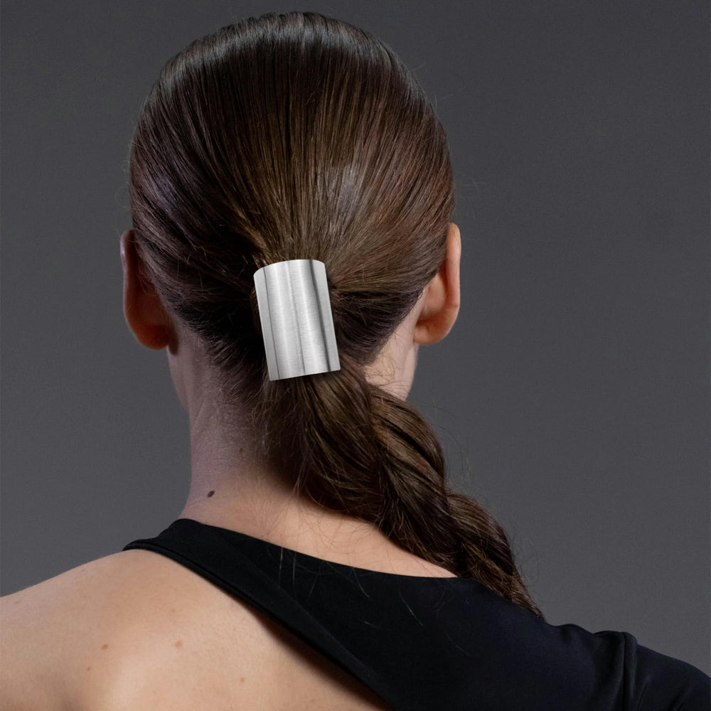Aswewamt silver hair cuff on ponytail for a sleek finish.