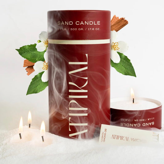 Atipikal Sand Candle 18oz with Saldalwood Jasmine scent floating on water