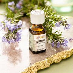 Aura Cacia Rosemary Essential Oil bottle on white background