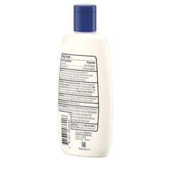 Close-up of creamy lotion spreading quickly on skin with non-greasy absorption.