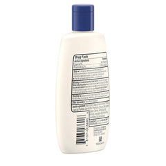 Aveeno lotion on elbow demonstrates non-greasy feel and quick absorption.