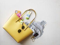 BabyGanics insect spray bottle in use, easy spray for park outings.