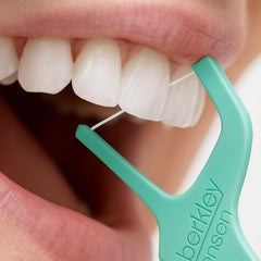 Floss sliding between teeth showing Barkley And Jensen Floss Up