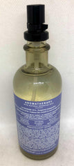 Pillow mist bottle with lavender and vanilla scent on a linen surface